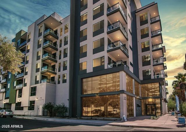 view of outdoor building at dusk