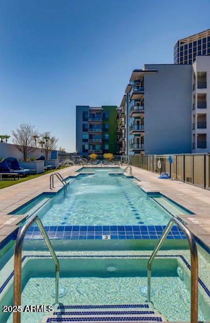 view of swimming pool featuring a patio area