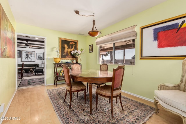 dining space featuring hardwood / wood-style floors