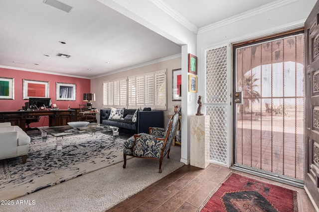 entrance foyer with hardwood / wood-style floors and crown molding