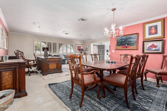 dining area with crown molding, carpet flooring, and an inviting chandelier