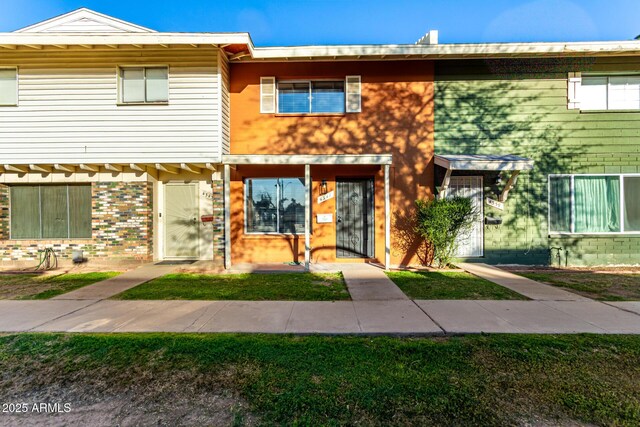 view of property with brick siding