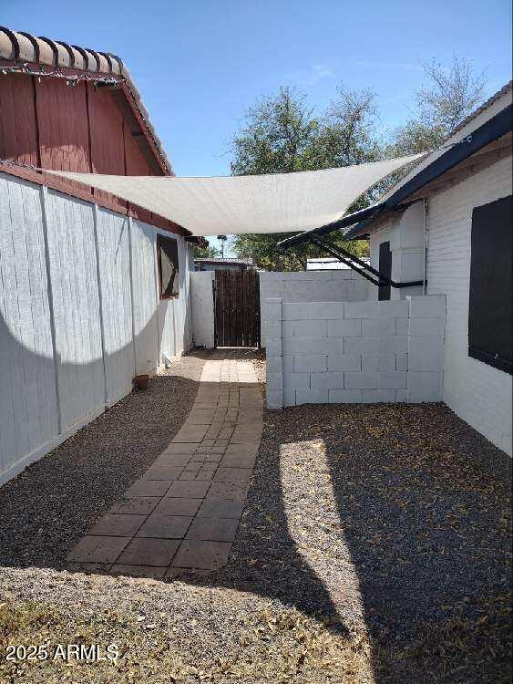 2045 W Orange Dr, Phoenix, AZ 85015 - view of yard with a gate and fence