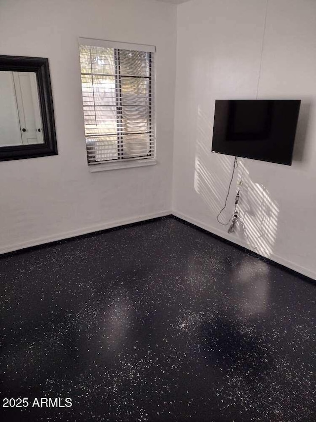 2045 W Orange Dr, Phoenix, AZ 85015 - unfurnished living room featuring baseboards
