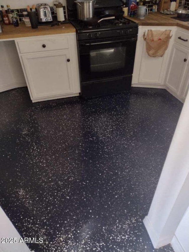 2045 W Orange Dr, Phoenix, AZ 85015 - kitchen with black range with gas cooktop, white cabinets, and wood counters