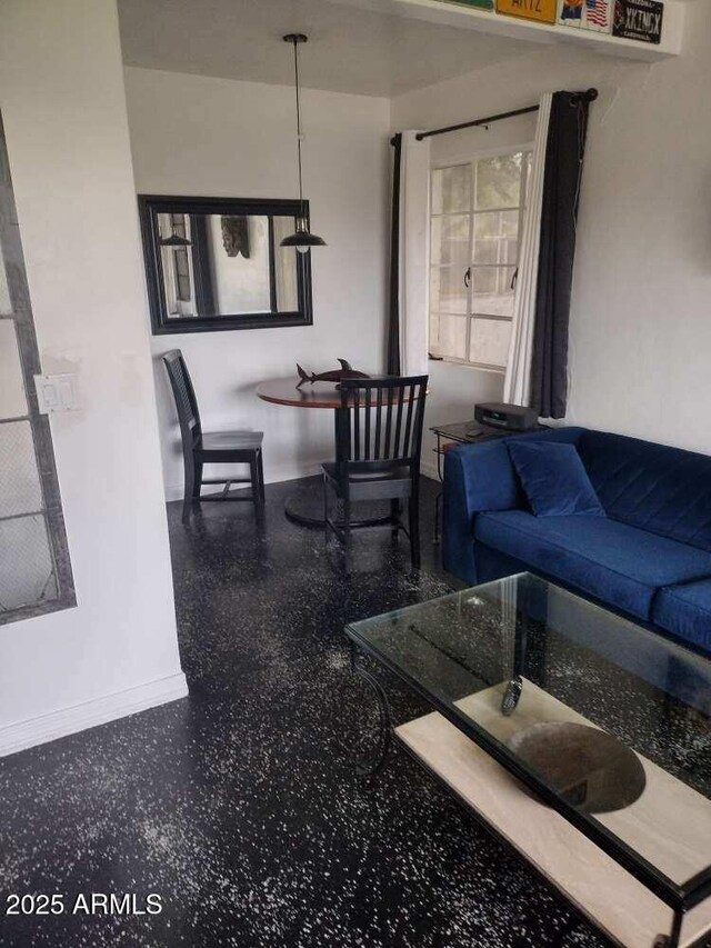 2045 W Orange Dr, Phoenix, AZ 85015 - living area with baseboards and speckled floor