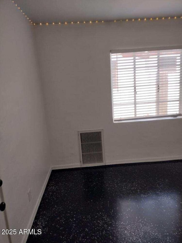 2045 W Orange Dr, Phoenix, AZ 85015 - empty room with baseboards and visible vents
