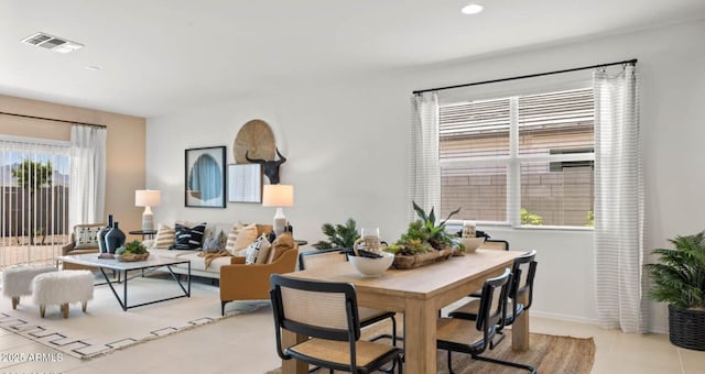 10622 W Bloch Rd, Tolleson, AZ 85353 - dining space featuring light tile patterned floors and recessed lighting