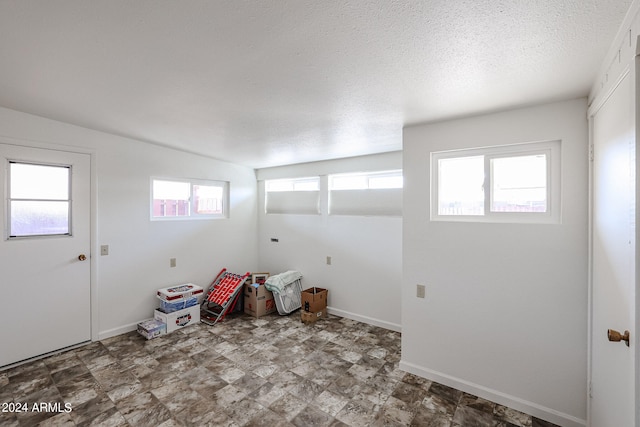 interior space with a textured ceiling