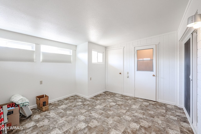 interior space featuring a textured ceiling