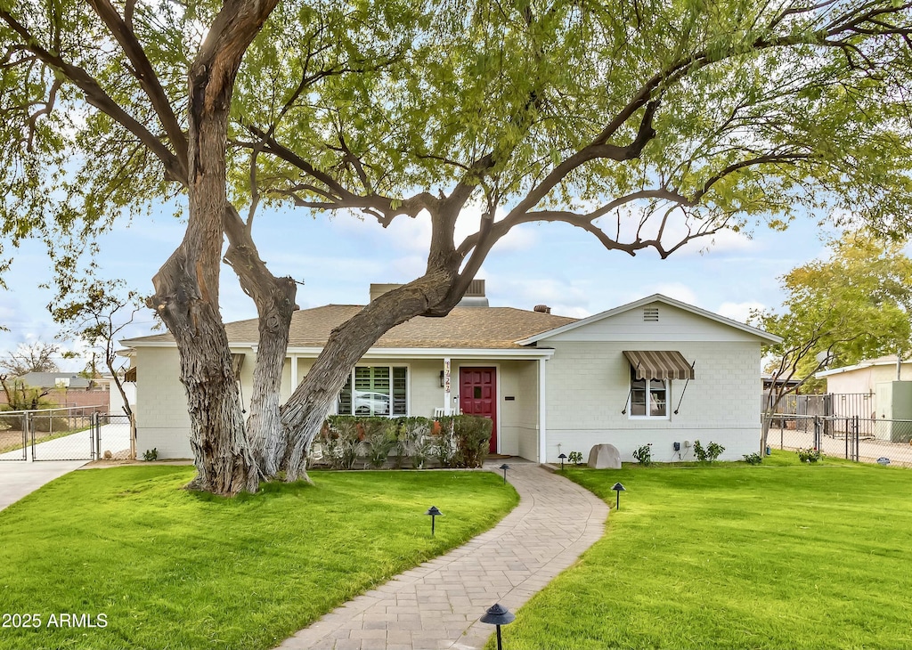 ranch-style house with a front yard