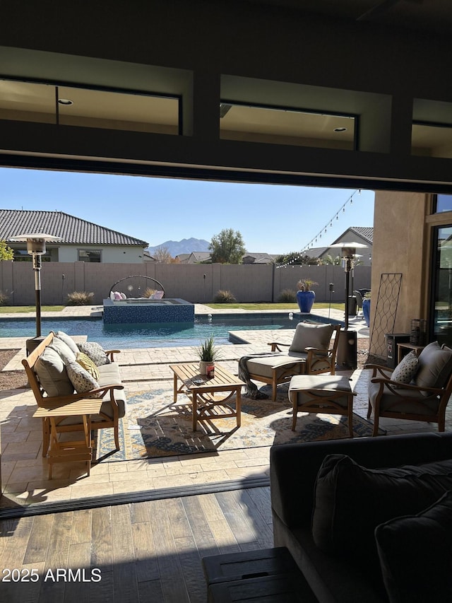 view of swimming pool with a mountain view