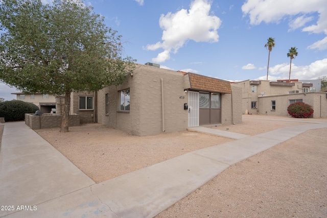 view of side of home featuring stucco siding