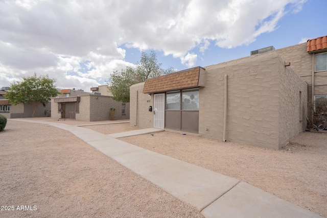 view of front of house featuring stucco siding