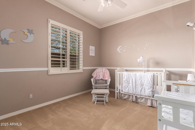 carpeted bedroom with ornamental molding, baseboards, and a ceiling fan