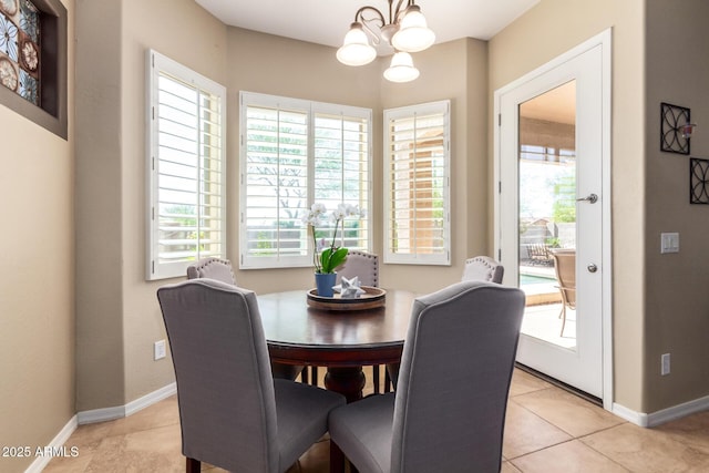 dining space featuring a chandelier, plenty of natural light, and light tile patterned floors