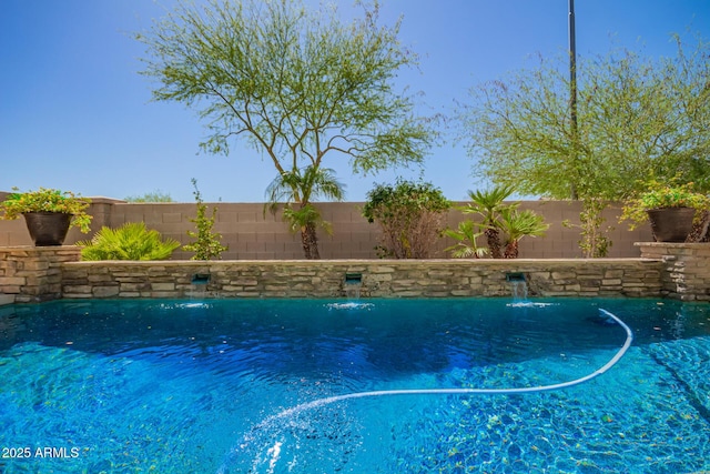 view of pool featuring a fenced backyard
