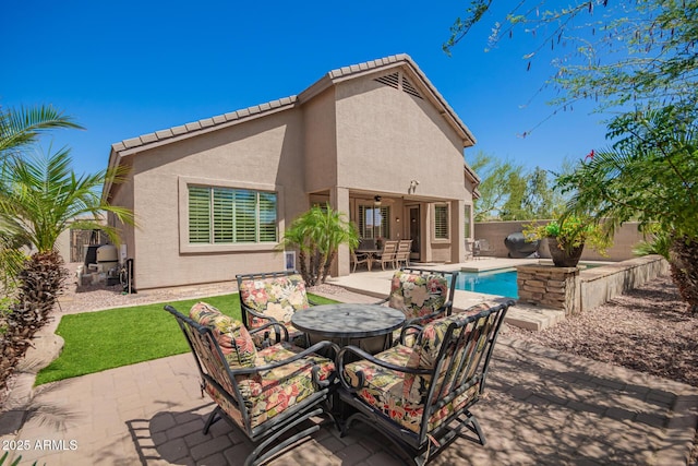 view of patio featuring a ceiling fan and a fenced backyard