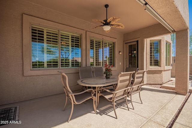 view of patio with a ceiling fan and outdoor dining space