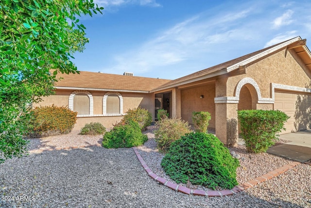 single story home featuring a garage