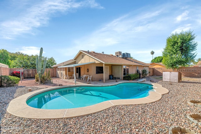 view of swimming pool with a patio and central AC