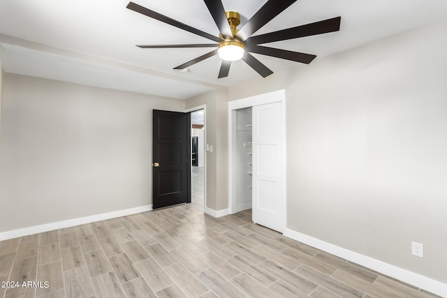 unfurnished room with ceiling fan and light hardwood / wood-style flooring