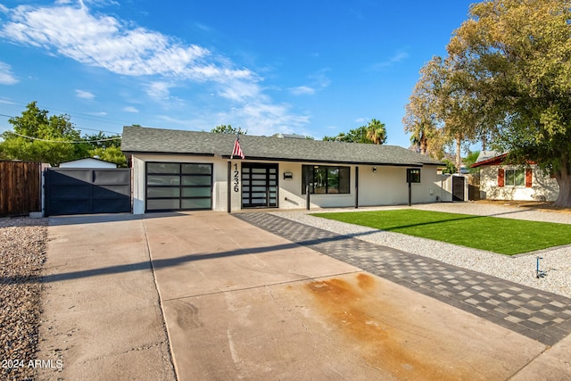 ranch-style home with a front yard