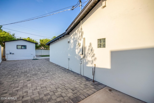 view of property exterior featuring a patio