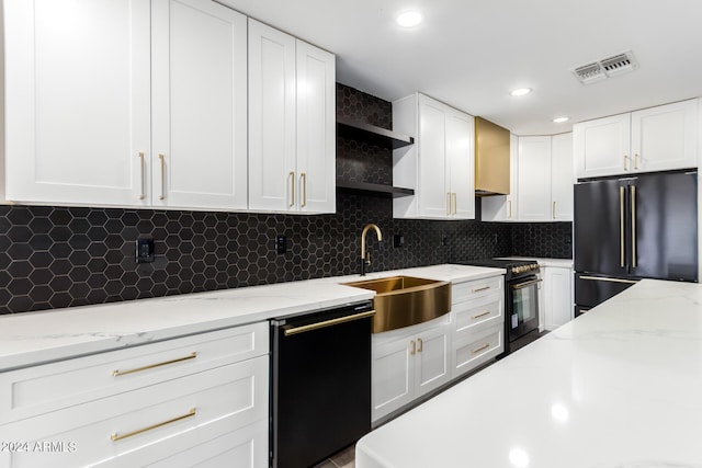 kitchen with white cabinets, sink, and black appliances