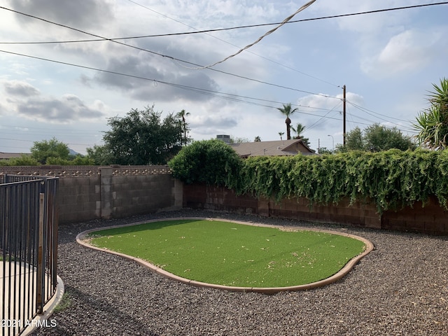 view of yard with a fenced backyard