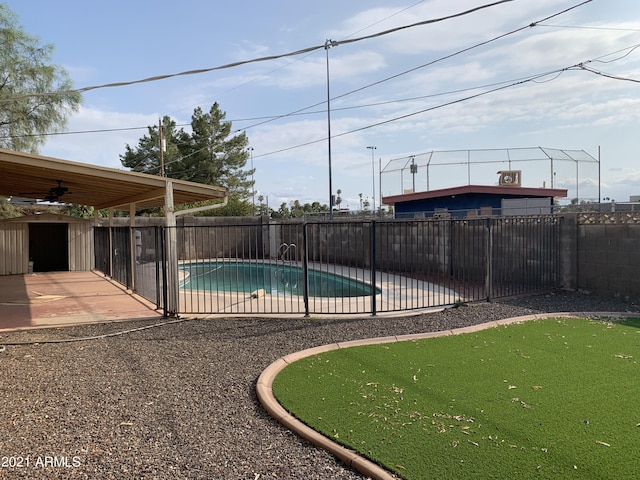 view of pool with a fenced in pool, a fenced backyard, a patio, and ceiling fan