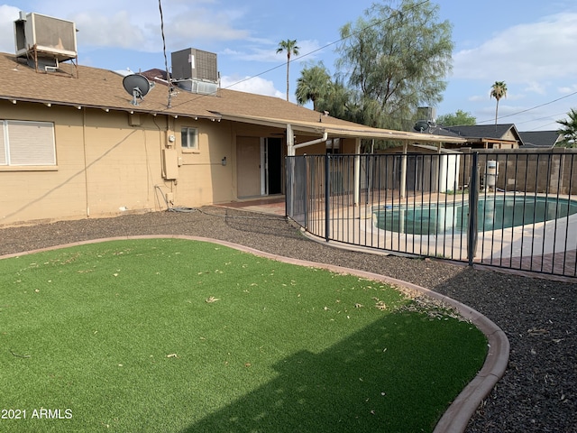 back of house with a patio, fence, a fenced in pool, and central air condition unit