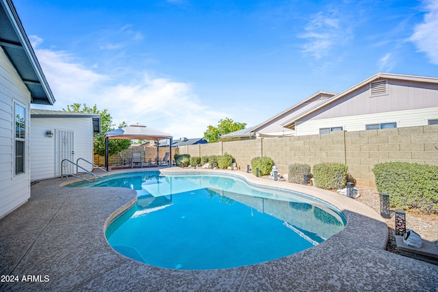 view of swimming pool featuring a gazebo and a patio area