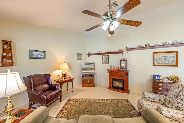 living room featuring light tile patterned floors, ceiling fan, and lofted ceiling