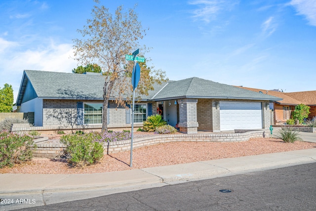 ranch-style home featuring a garage