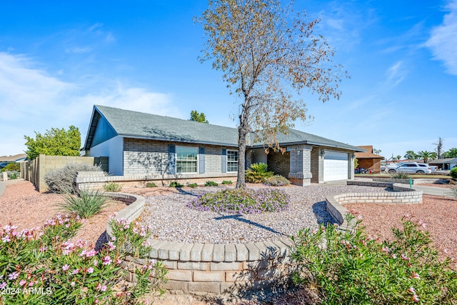 single story home with a garage