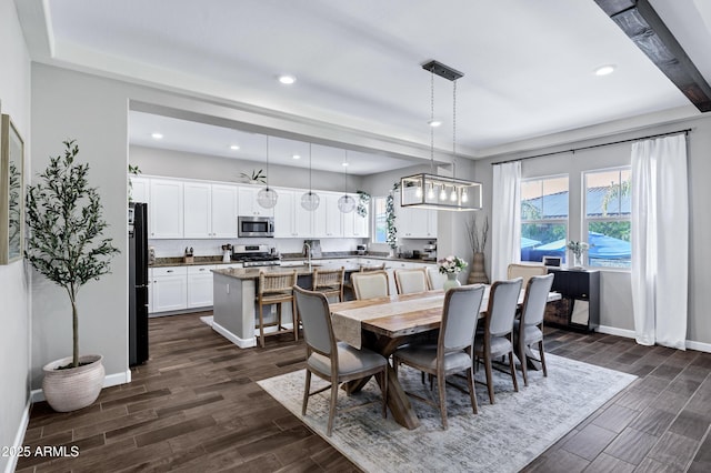 dining area with dark wood-style floors, recessed lighting, and a wealth of natural light