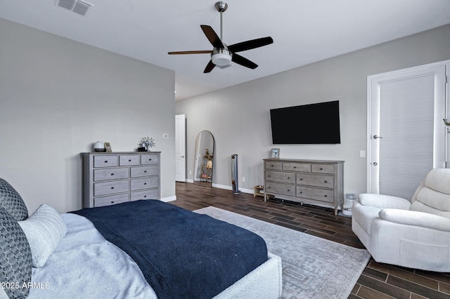 bedroom featuring wood finish floors, visible vents, ceiling fan, and baseboards