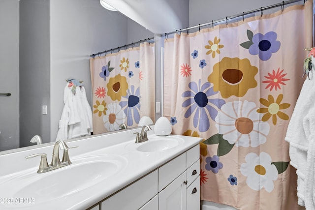 full bathroom featuring double vanity, a shower with curtain, and a sink