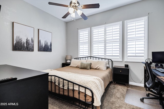 bedroom with ceiling fan, baseboards, and carpet floors