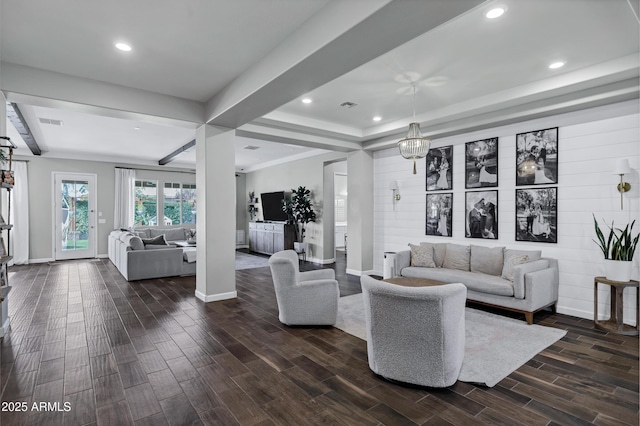 living area with recessed lighting, baseboards, visible vents, a raised ceiling, and dark wood-type flooring