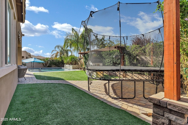 view of yard featuring an outdoor pool, a fenced backyard, and a patio area