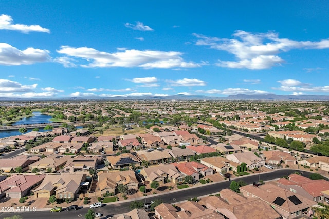 aerial view featuring a residential view and a water and mountain view