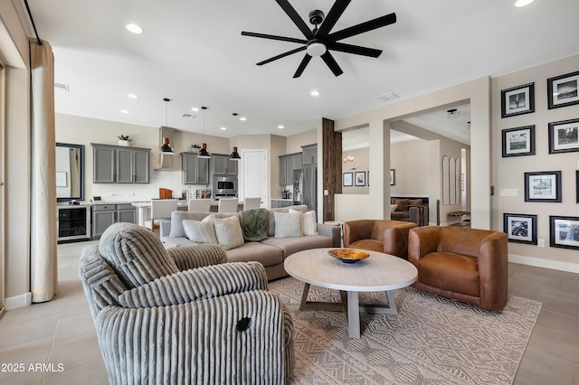 living room with wine cooler, light tile patterned flooring, recessed lighting, a ceiling fan, and visible vents