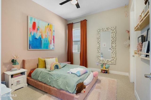 bedroom with a ceiling fan, carpet, and baseboards