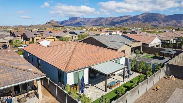 birds eye view of property with a mountain view and a residential view