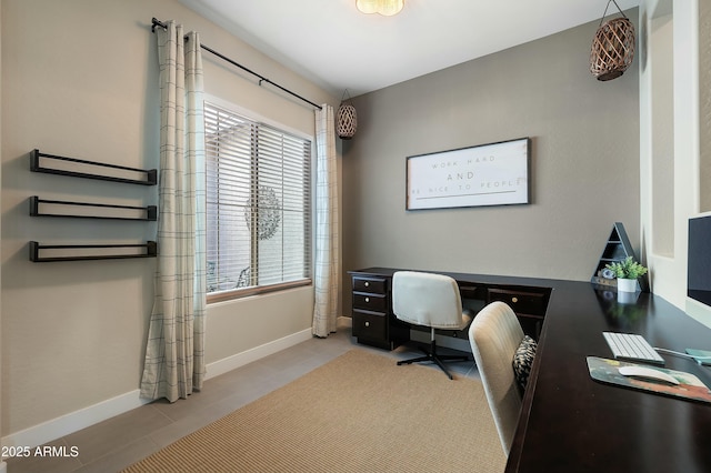 office space featuring tile patterned flooring and baseboards