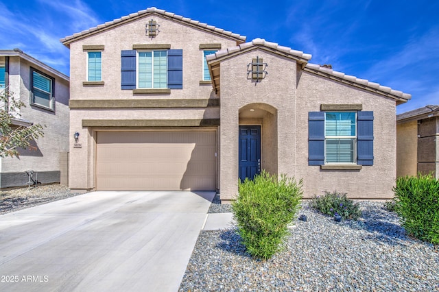 traditional-style home with a garage, driveway, stucco siding, and a tile roof