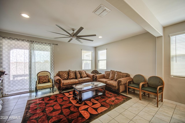 living room with baseboards, recessed lighting, light tile patterned floors, a ceiling fan, and visible vents