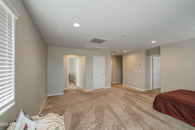 bedroom with light carpet, baseboards, visible vents, and recessed lighting